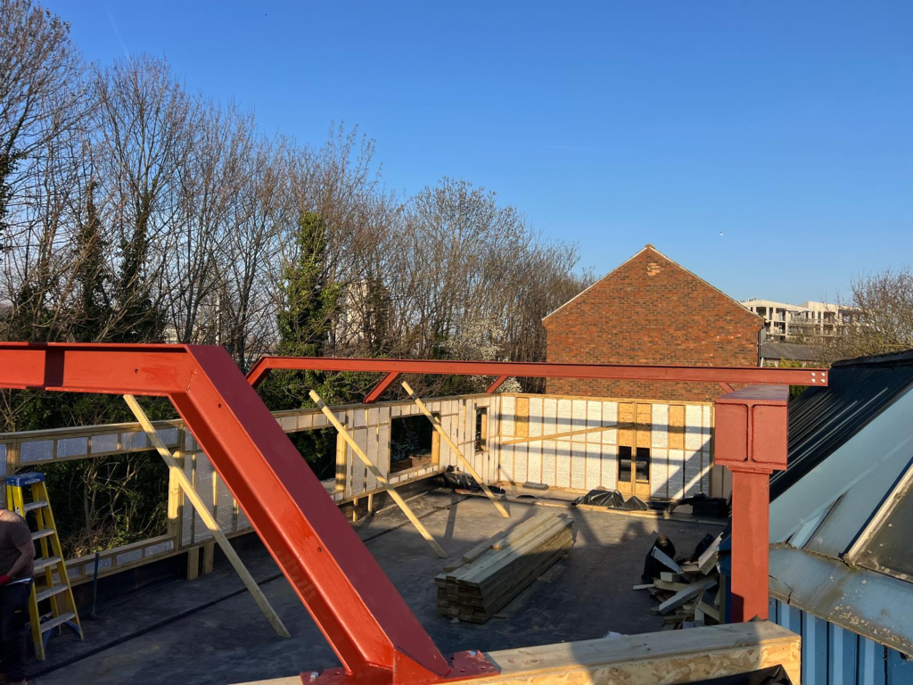 Steel beam installation at Winterburn Close in London N11 by James Steel